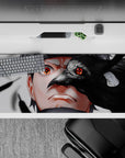 36x16 inches Naruto-style desk pad in smoky grays and glossy blacks with a red Sharingan, dark mood.