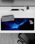 Moody space mouse pad 32x12 inches in inky blacks with electric blues and smoky purples.