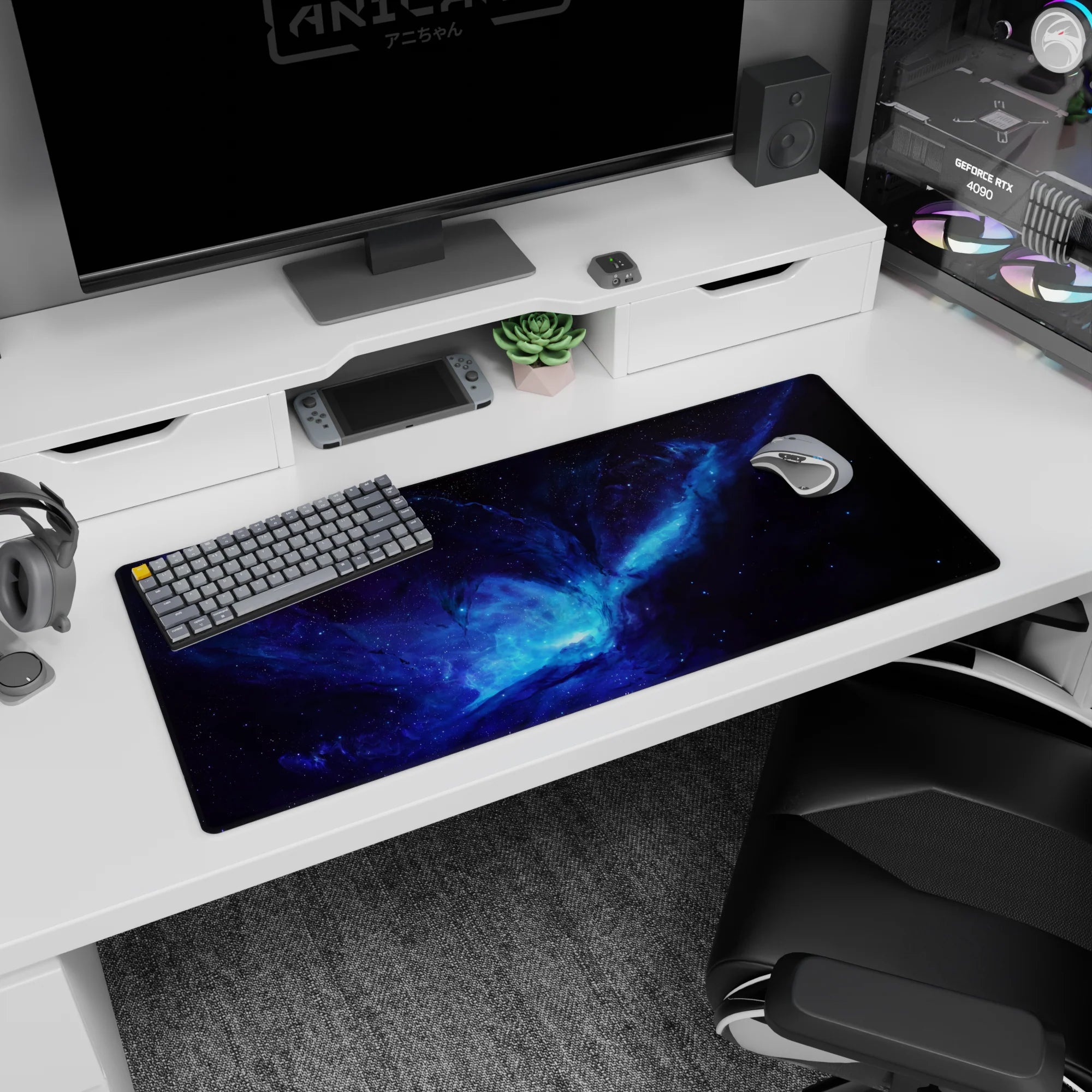 Desk pad 36x16 inches showing an inky space portal-like core surrounded by swirling galaxy dust.