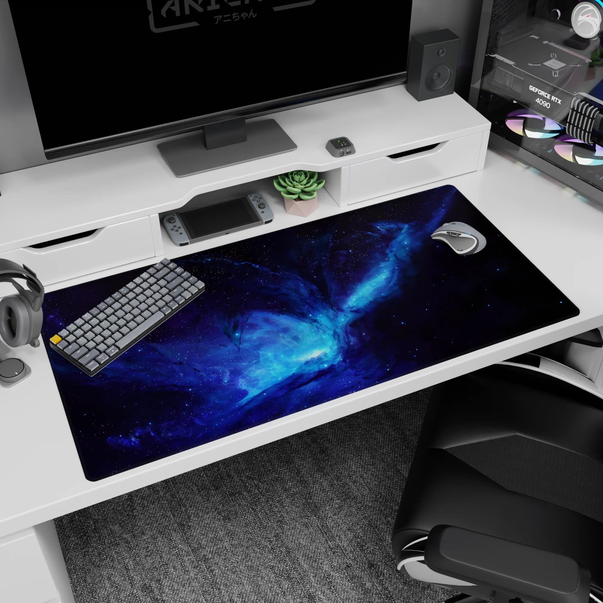 Desk pad showing a glowing cosmic portal core in an inky nebula swirl, 40x20 inches.