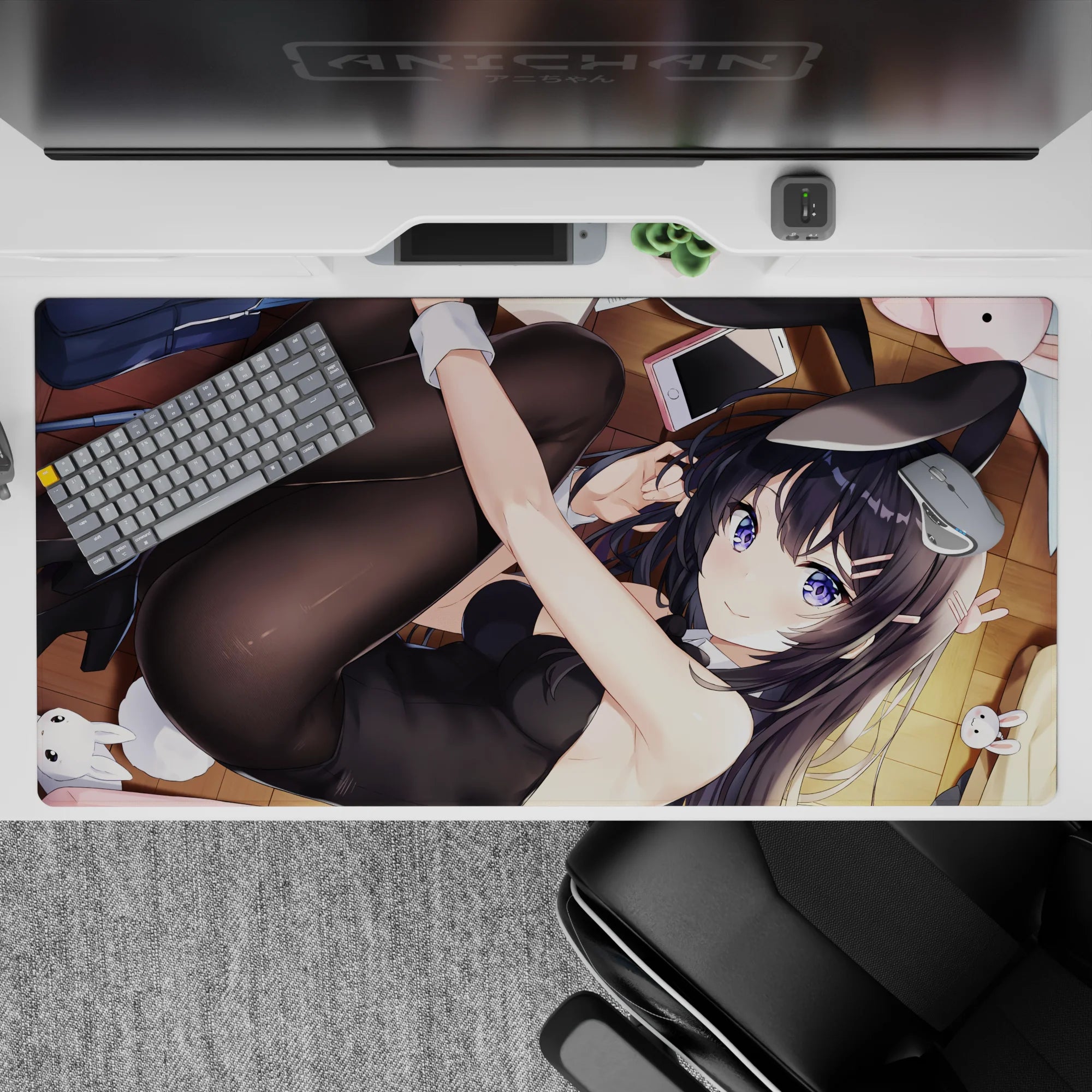 Cozy flirty violet-and-black anime desk pad 40x20 inches, warm wood floor vibe with bold color pop.