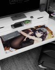 Playful violet-eyed anime girl lounging on wooden floor desk pad 36x16 inches, phone tossed beside her.