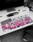 Demon girl with icy silver hair and tiny black horns on anime desk pad 36x16 inches, cat beside her.