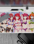 Vibrant anime desk pad 40x20 inches in pastel sky tones, playful flirty mood with bold hair colors.