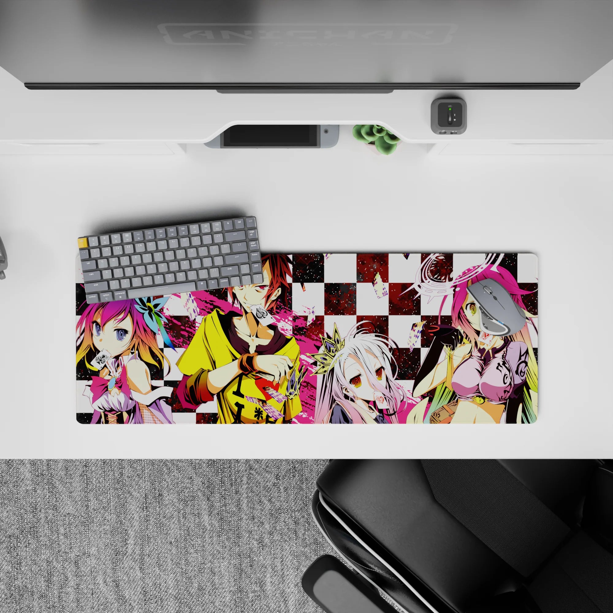 Pink splash and bold black-white anime mouse pad 32x12 inches, loud chaotic vibe with glossy-eyed characters.