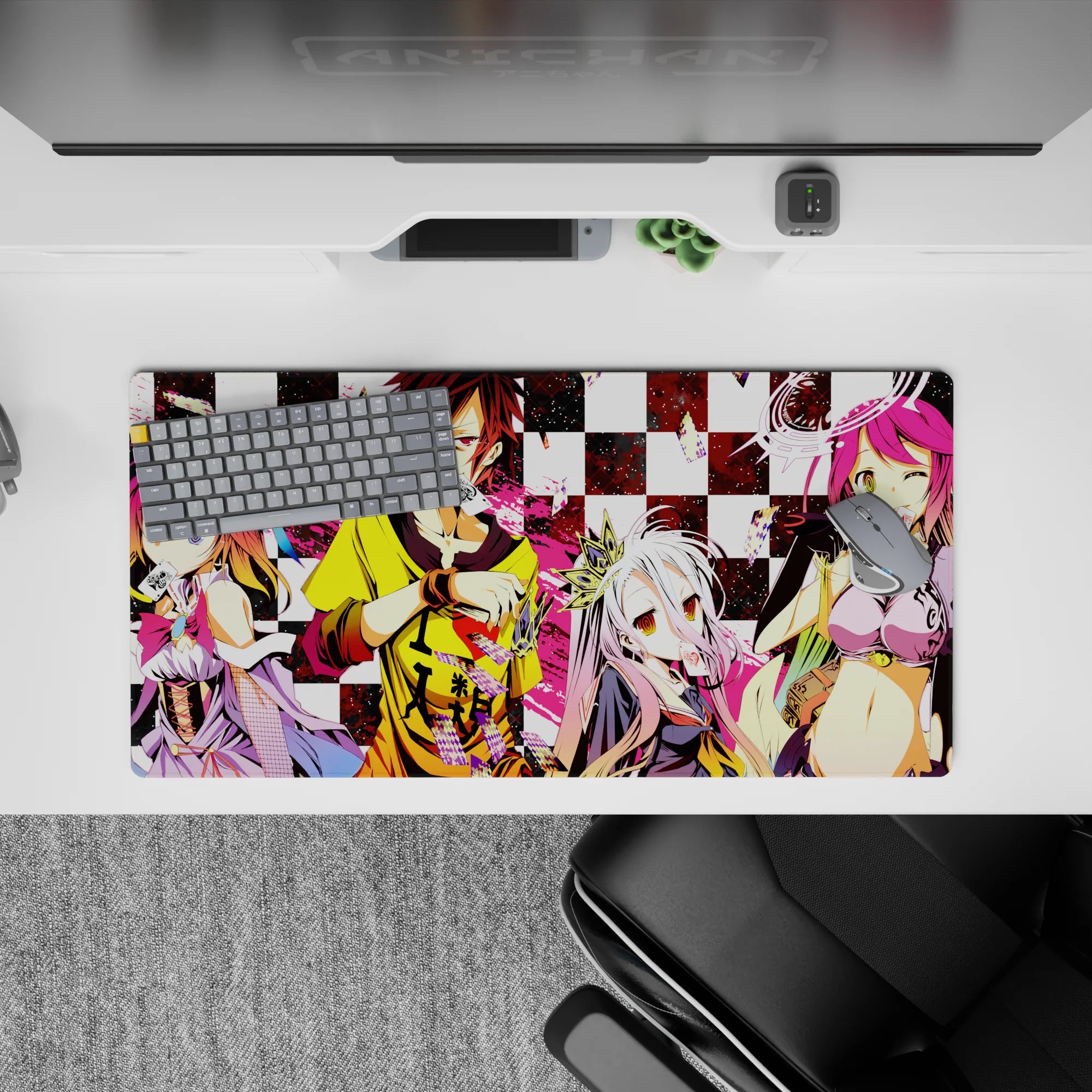 Chaotic cute 32x16 inches anime mouse pad in pink splashes over black-and-white checkerboard, loud vibe.
