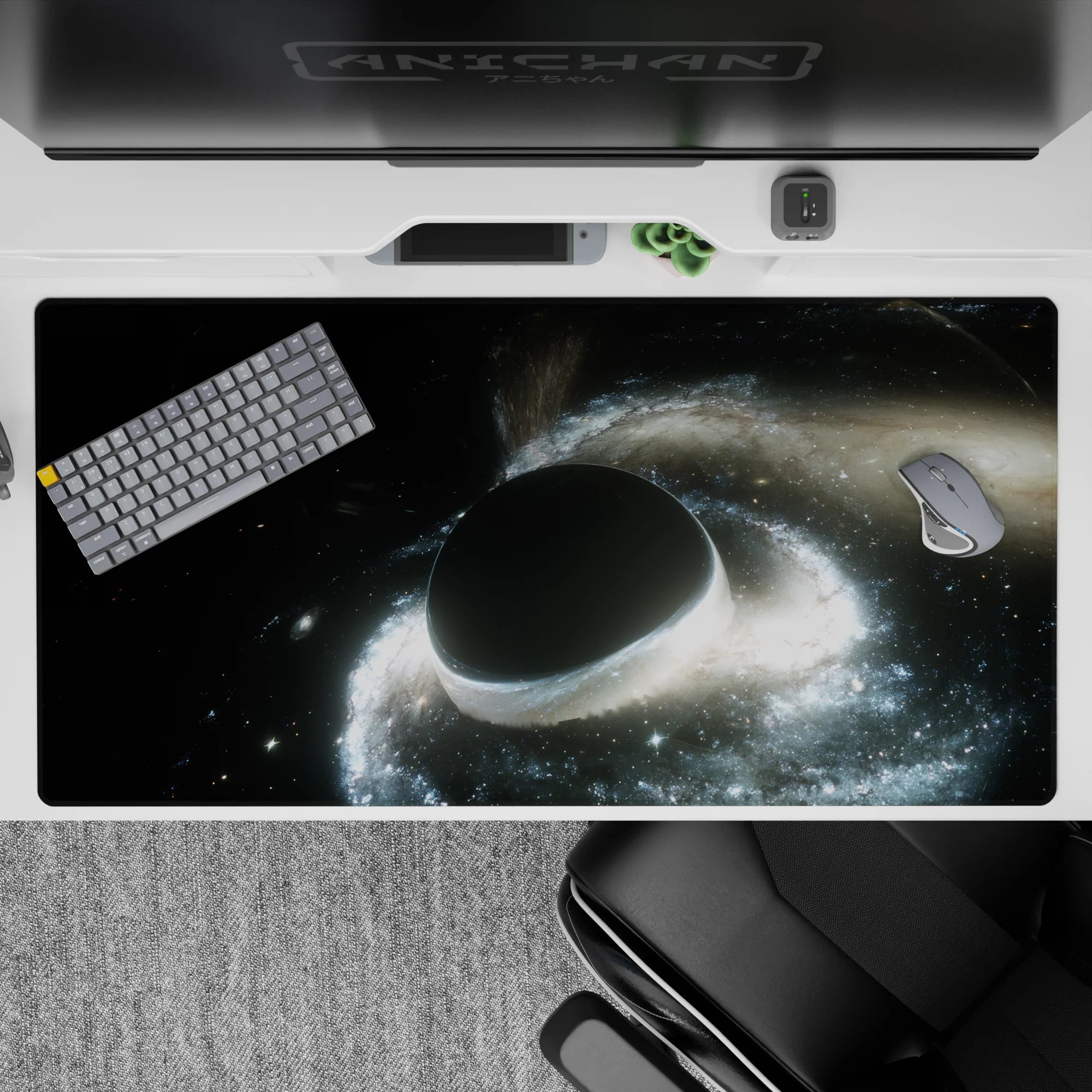 Moody black and silver cosmic desk pad 40x20 inches with soft gray glow and star specks.