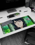 36x16 inches Naruto desk pad showing Sasuke Uchiha staring forward, dark hair framing his glowing Rinnegan.