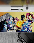 Warm gold background anime desk pad 40x20 inches with vivid reds, blues, and steel tones.