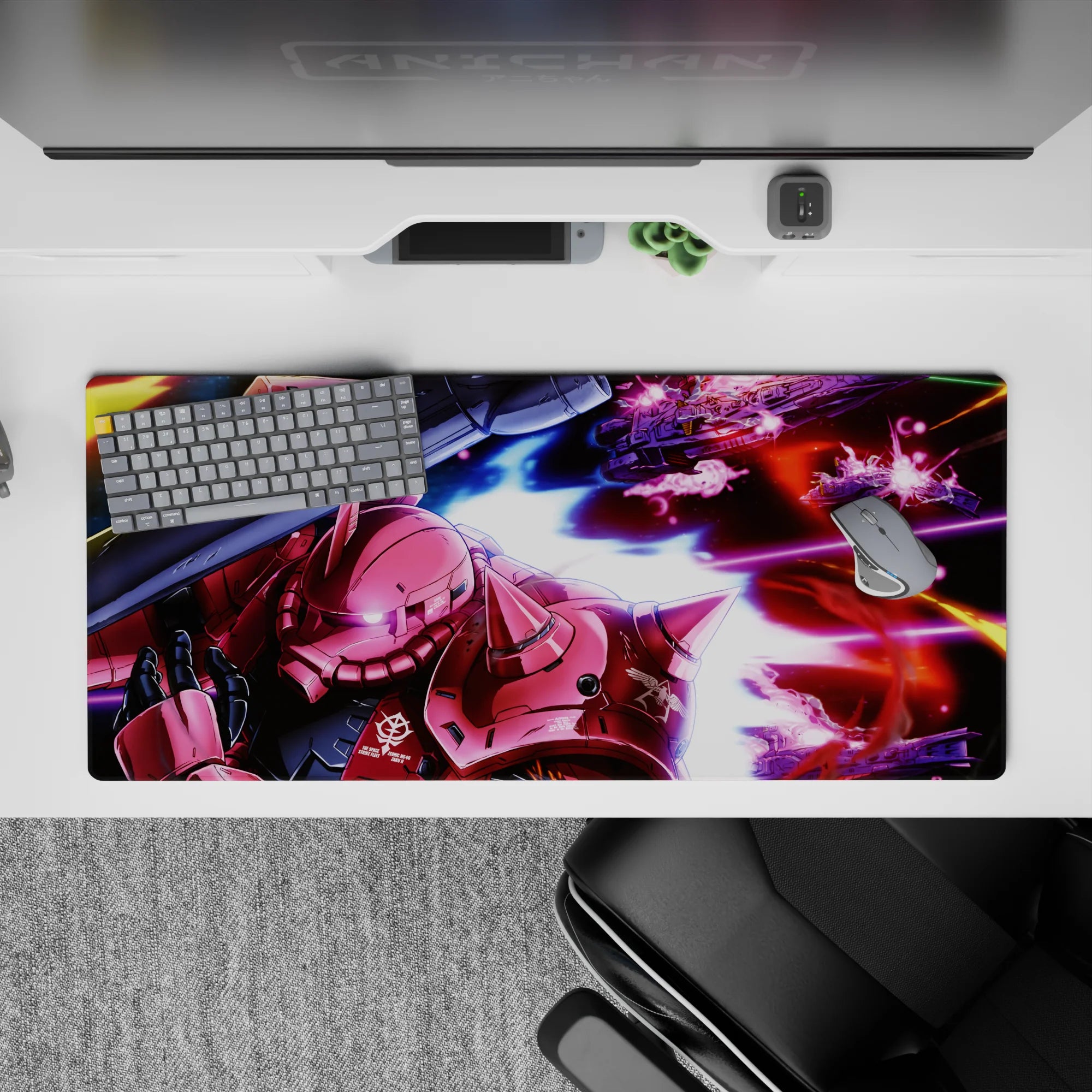 Neon magenta blasts on deep black and streaky blue anime desk pad 36x16 inches, cockpit vibe.