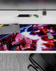 Neon magenta blasts on deep black and streaky blue anime desk pad 36x16 inches, cockpit vibe.