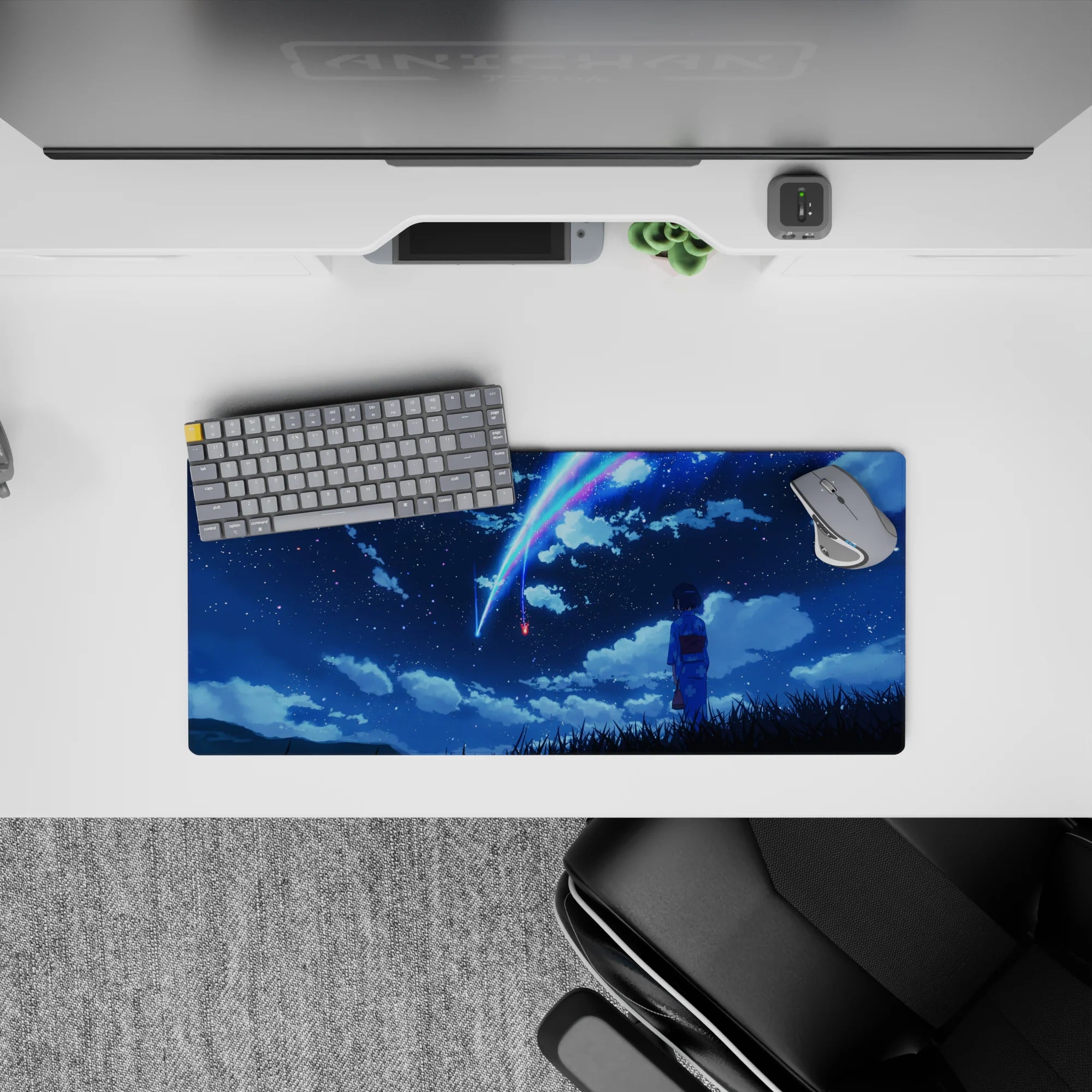 28x12 inches anime mouse pad in deep navy with neon blue-pink comet streaks, calm dreamy night sky.
