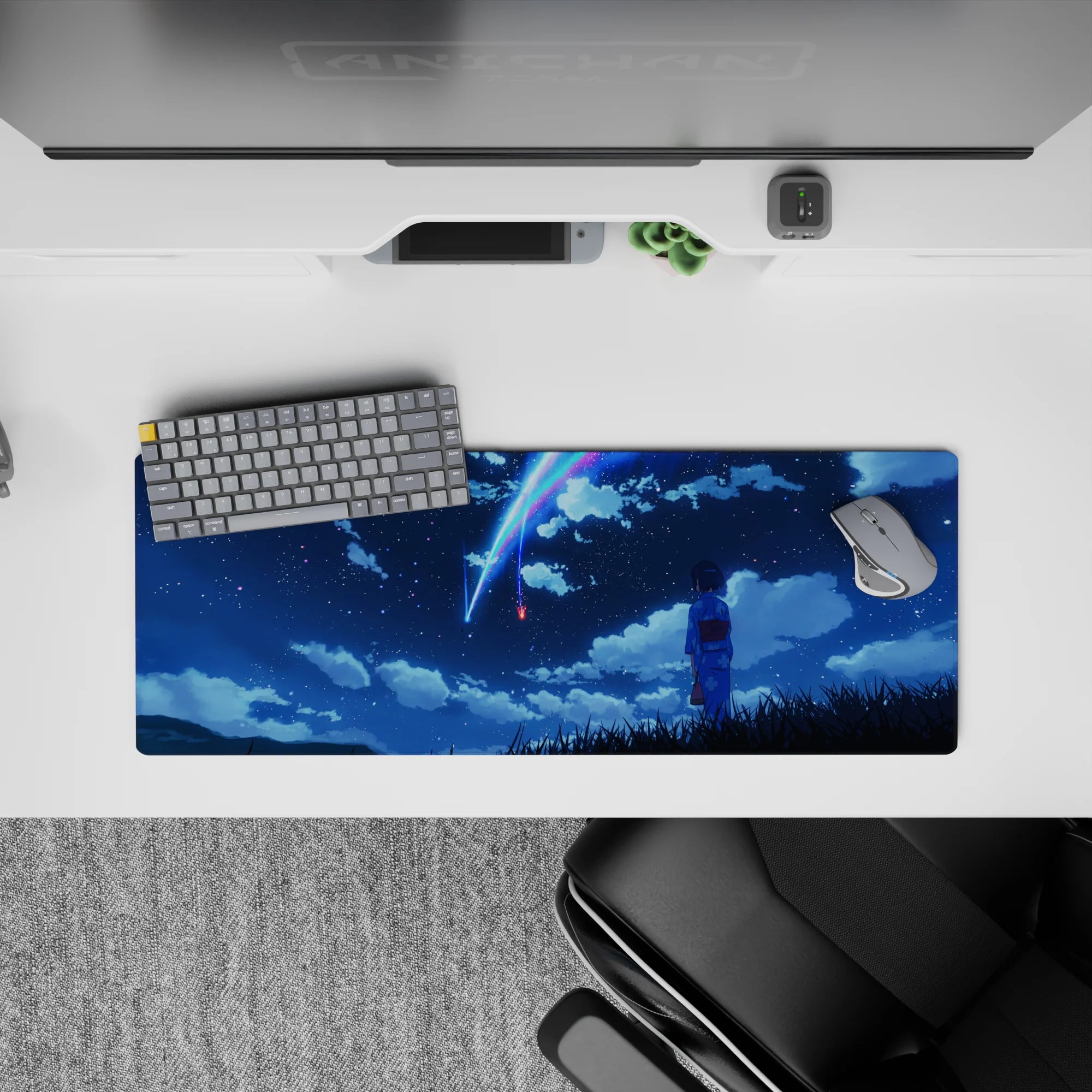 32x12 inches anime desk mat in deep navy with neon blue and pink comet streaks, calm dreamy glow.