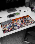 Kunoichi in fishnets and open-front jackets on an anime girl desk pad 36x16 inches, smirks and headbands.