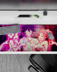 36x16 inches anime desk pad in neon pink chaos, vivid night-pop print with playful teasing energy.