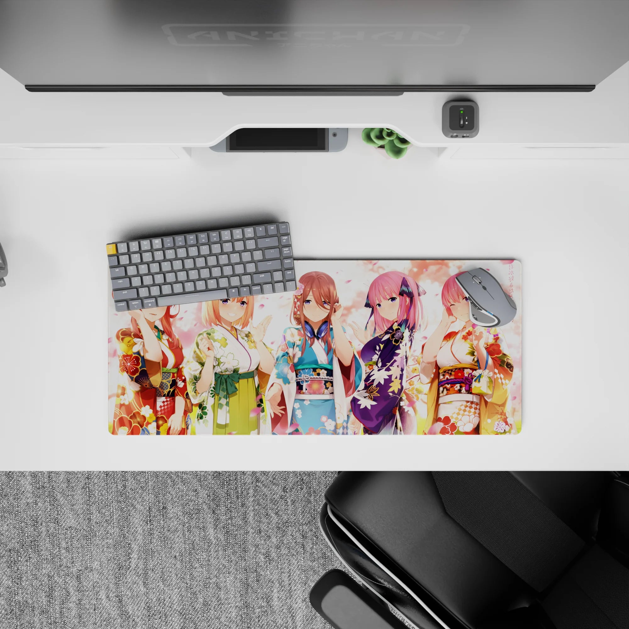 28x12 inches pastel kawaii desk mat in reds, blues, violet and gold, with cozy pink petals and smiles.