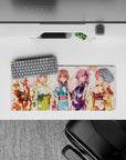 28x12 inches pastel kawaii desk mat in reds, blues, violet and gold, with cozy pink petals and smiles.