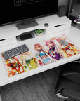 Five smiling anime girls in bright festival yukata desk pad 36x16 inches with drifting petals.