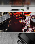 Dark ink stains, orange fire glow, and stormy shadows on an anime desk pad 40x20 inches.