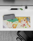Warm orange-to-pink hair and golden eyes anime girl mouse pad 28x12 inches, cozy playful desk vibe.