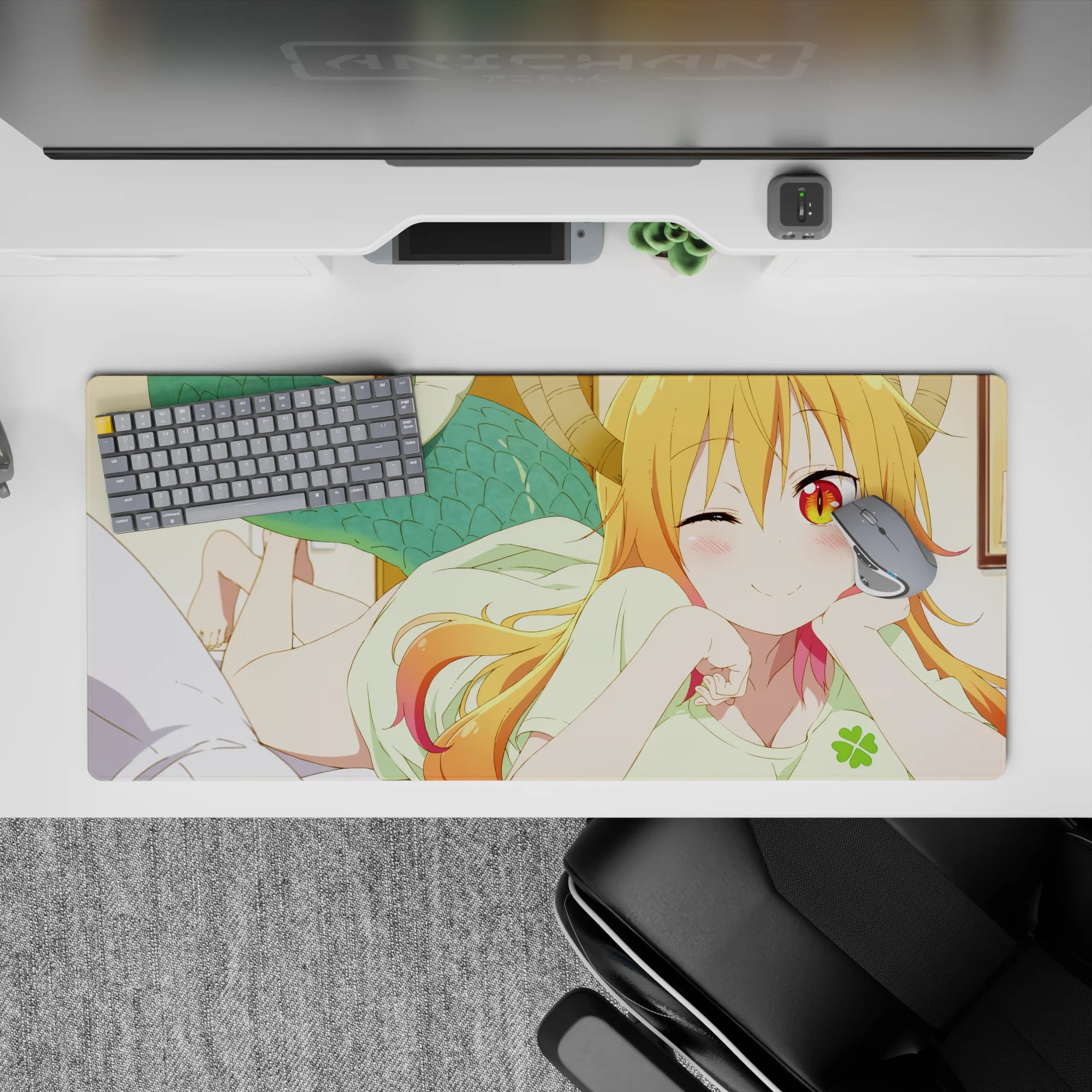 36x16 inches desk pad with warm orange-to-pink hair, golden eyes, cozy playful anime vibe.