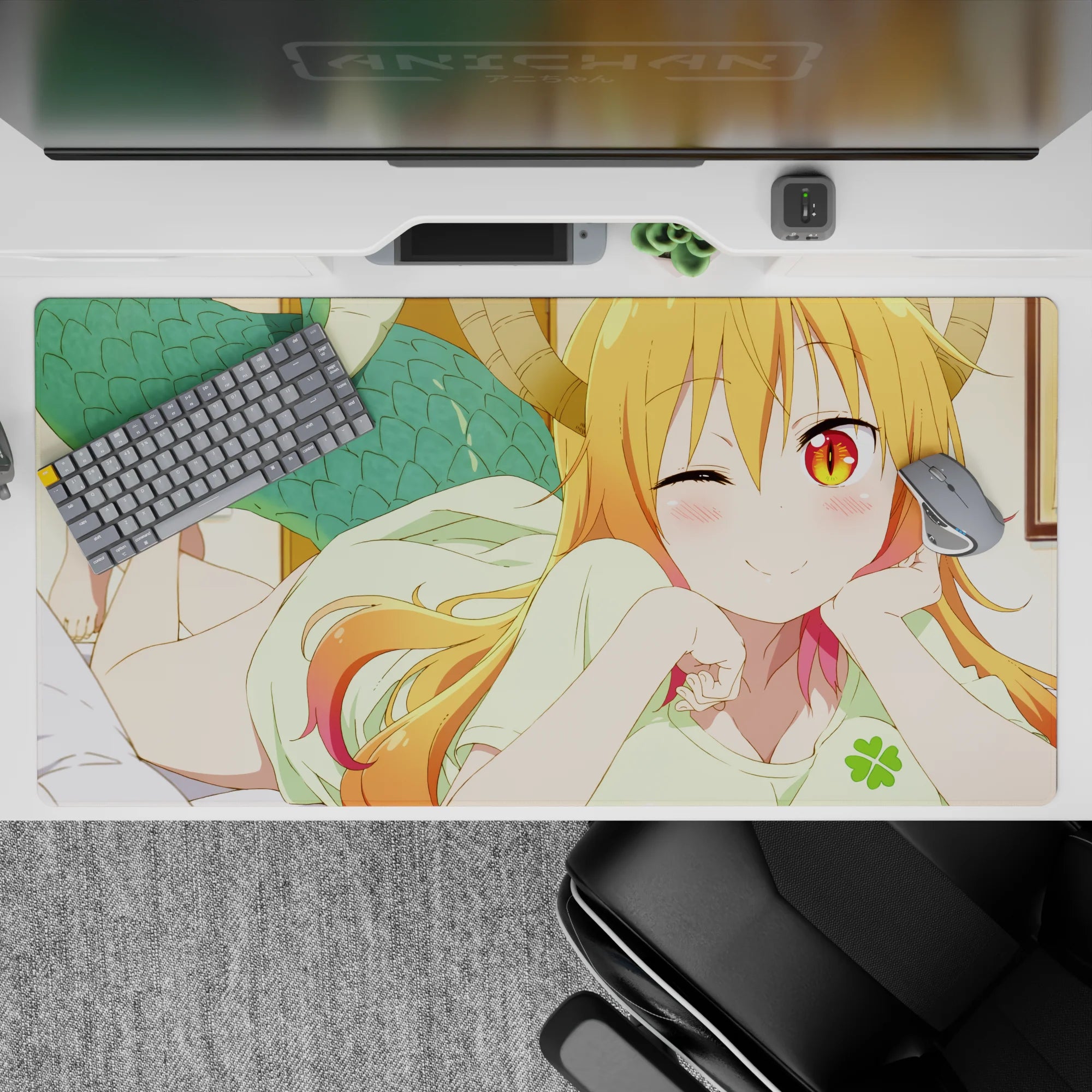 40x20 inches desk pad in warm orange-to-pink hair tones, golden eyes, cozy playful anime vibe.