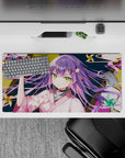 32x16 inches anime mouse pad in pink, teal, and gold with cozy mischievous festival-night vibe.