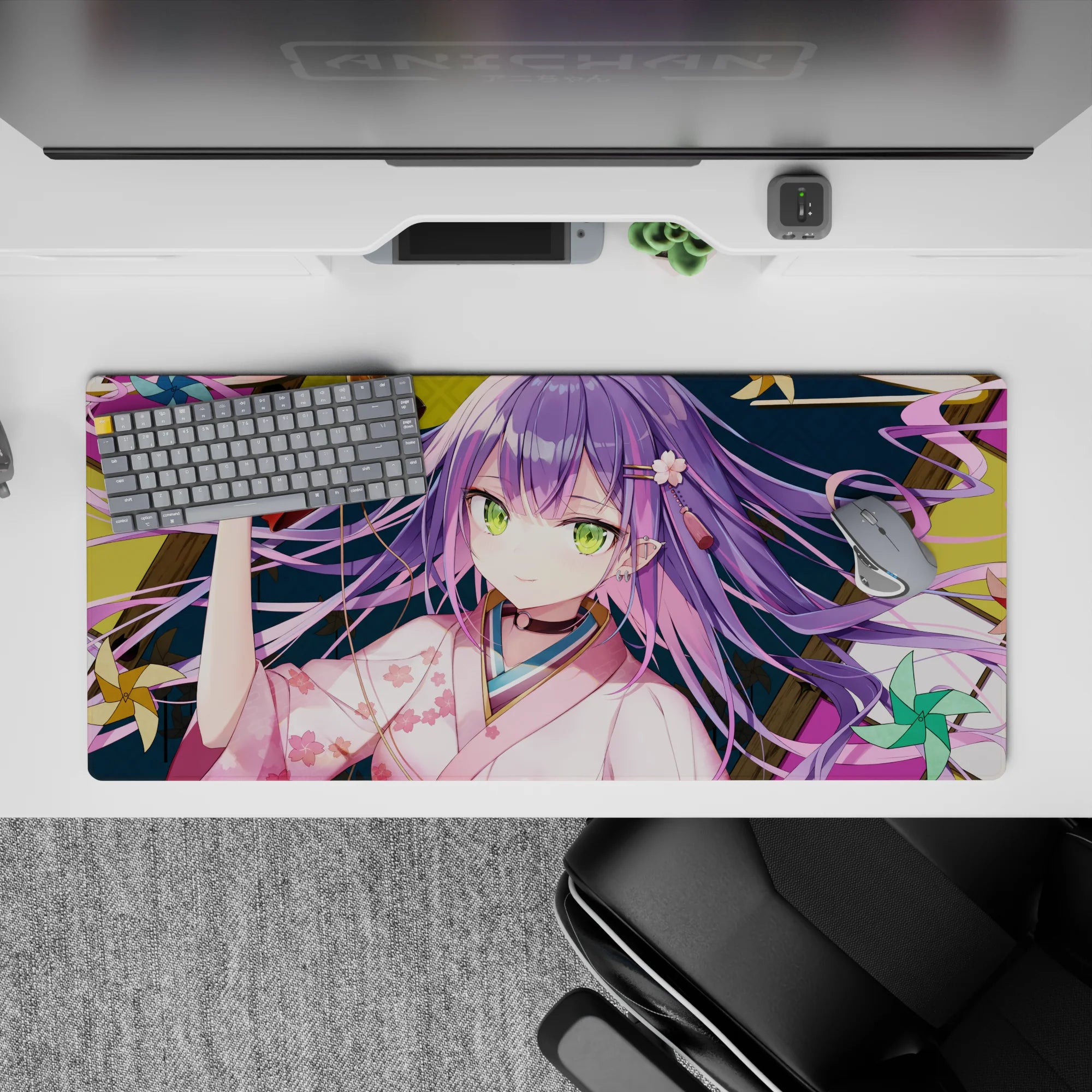 Cozy mischievous anime desk pad 36x16 inches in pink, teal, and gold with festival night ribbon swirls.