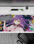 Cozy mischievous anime desk pad 36x16 inches in pink, teal, and gold with festival night ribbon swirls.