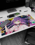 Purple-haired anime girl lounging with red oni mask on desk pad 40x20 inches, bright green eyes.
