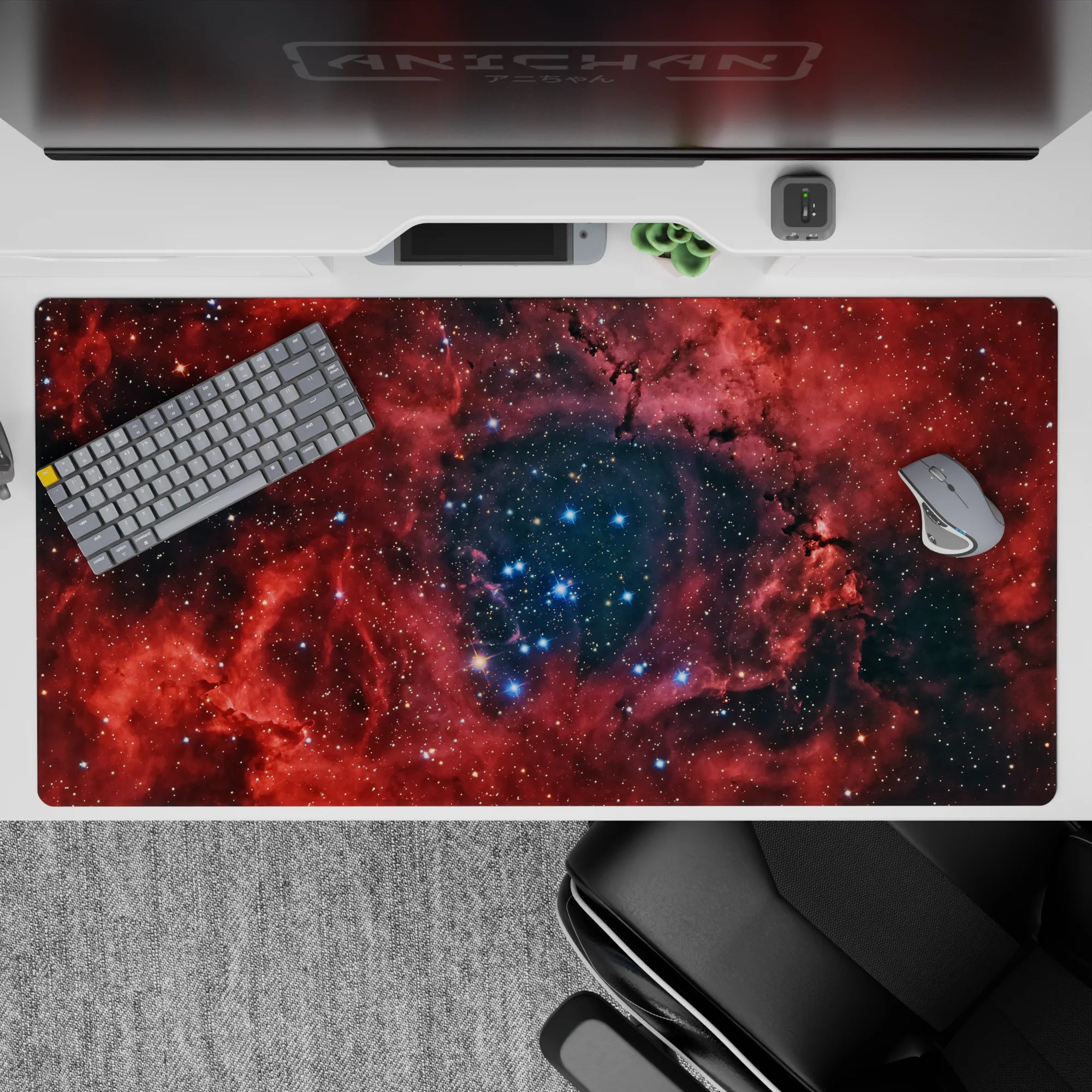 Deep red nebula on near-black space desk pad 40x20 inches with cozy, magical night vibe.
