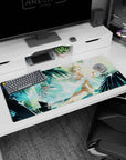 White-haired crowned goddess lounging under palms on anime desk pad 36x16 inches, floating petals and scarf.