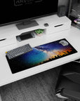 Starry forest silhouette scene mouse pad, 32x12 inches, with Milky Way sky and low amber horizon light.