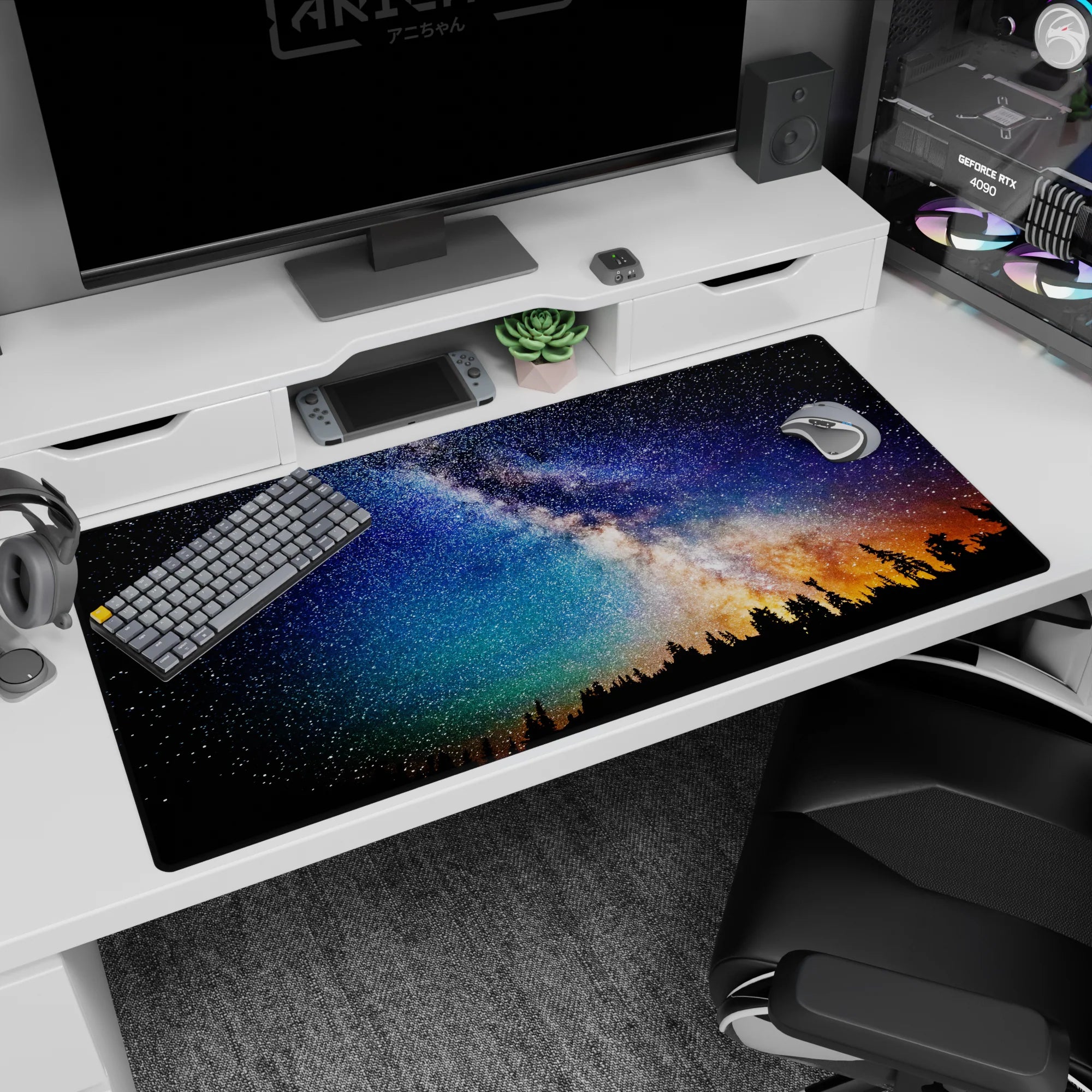 Star-filled sky over pine silhouettes desk pad 40x20 inches, deep blue tones with low amber horizon.