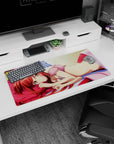 32x16 inches anime girl mouse pad showing a golden-eyed redhead lounging on a pink pillow with sparkly highlights.