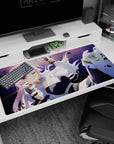 Winking pink-haired anime girl in sleek black outfit amid flying debris on 40x20 inches desk pad.
