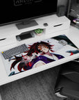 Kokushibo from Demon Slayer anime on a 36x16 inch desk pad, featuring his six amber eyes, red swirls, and inky blue hair.
