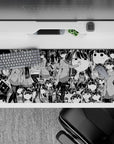 36x16 inches black-and-white manga line art desk pad, funny deadpan vibe with wide eyes and tiny frowns.