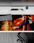 36x16 inches anime desk pad in warm crimson and shadow tones, ember specks, and glowing highlights.