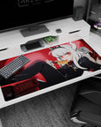 White-haired demon girl lounging with honey spoon on anime desk pad 40x20 inches, stacks of books behind.