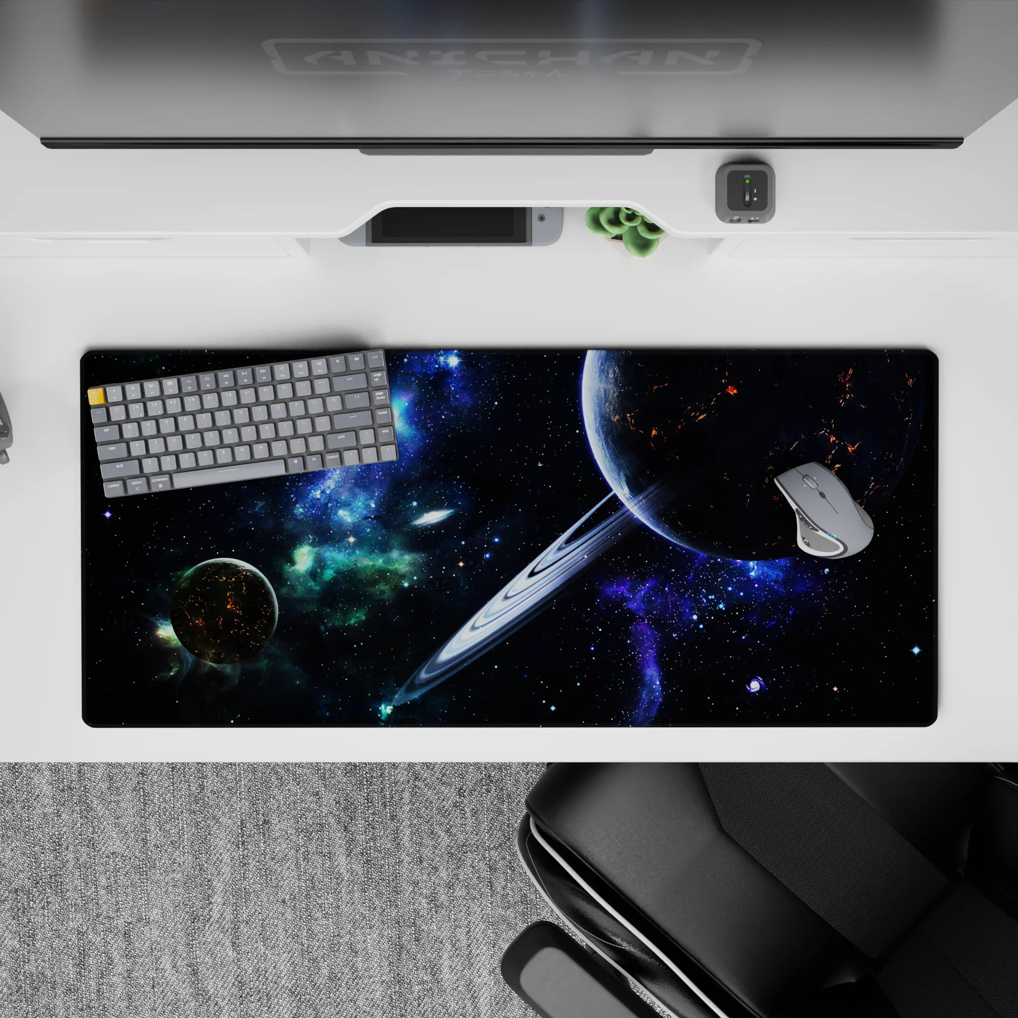 Midnight-cosmos desk pad 36x16 inches in deep black, neon blue, and smoky green tones.