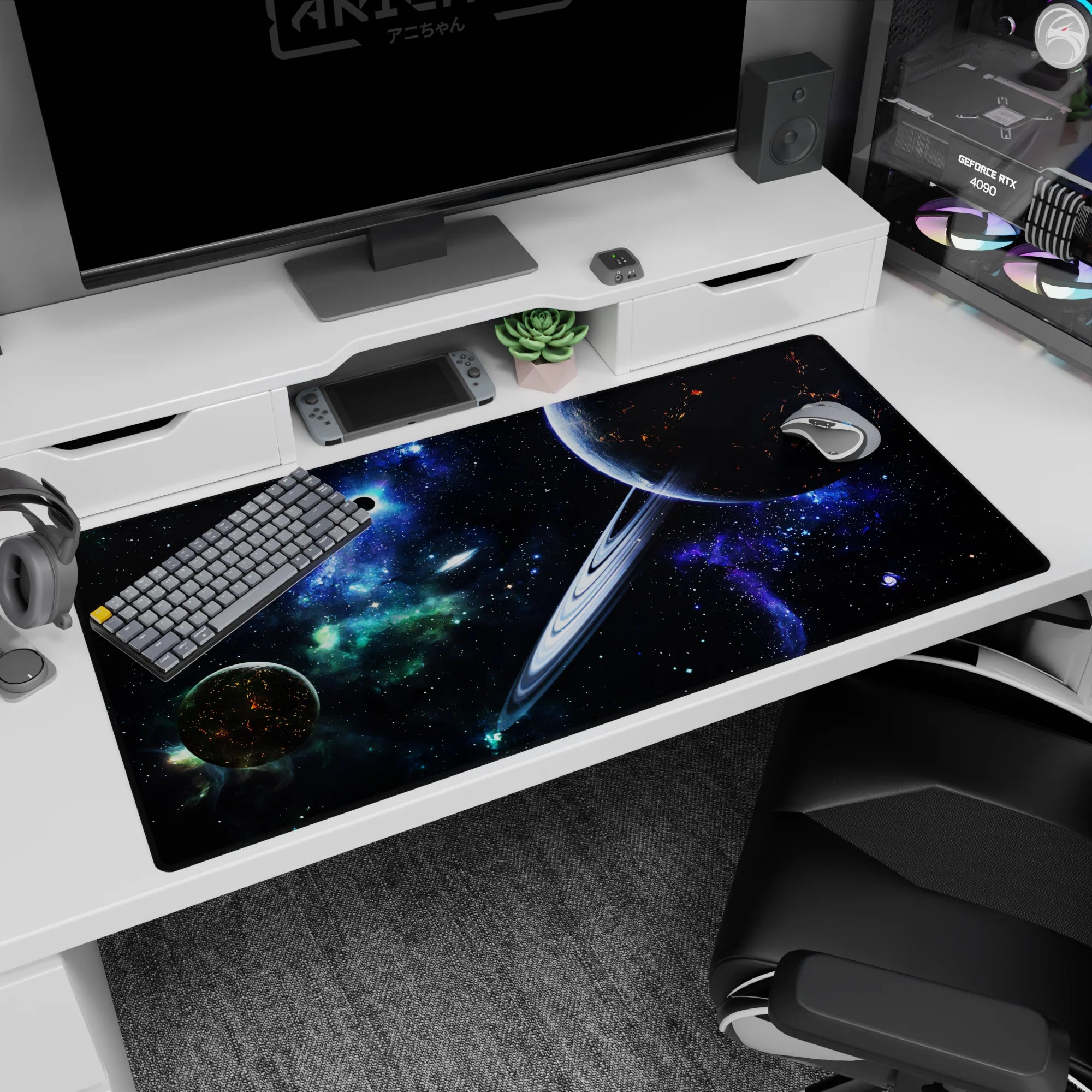 Ringed planet scene desk pad 40x20 inches in star-filled space with glowing ember-like cracks on the planet.