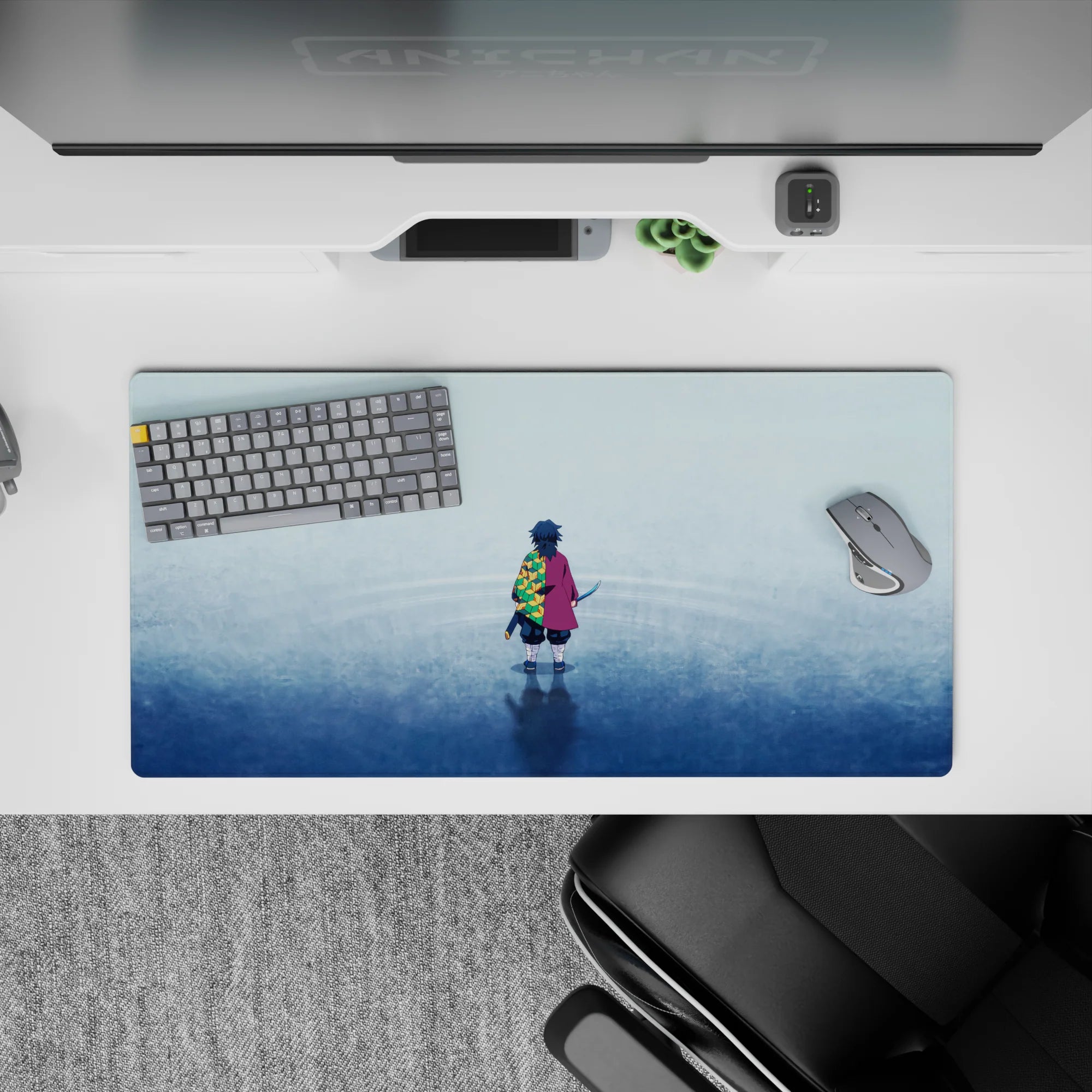 Giyu Tomioka from Demon Slayer on a 32x16 inch mouse pad, featuring a tranquil blue and hexagonal green-yellow pattern.