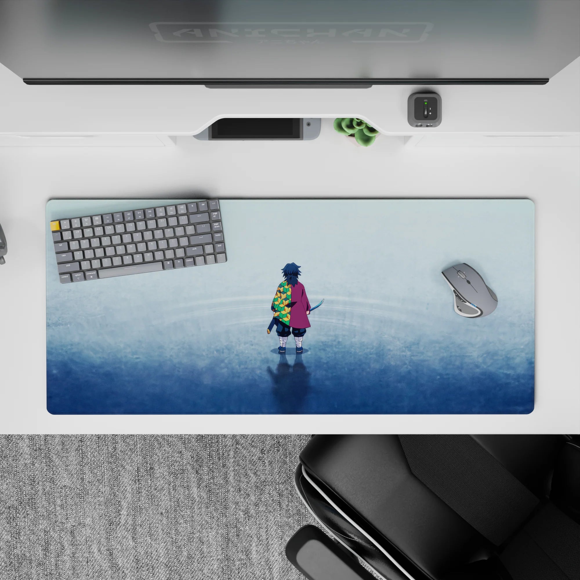 Giyu Tomioka on a tranquil blue surface, 36x16 inch anime desk pad featuring bold hexagonal patterns from Demon Slayer.