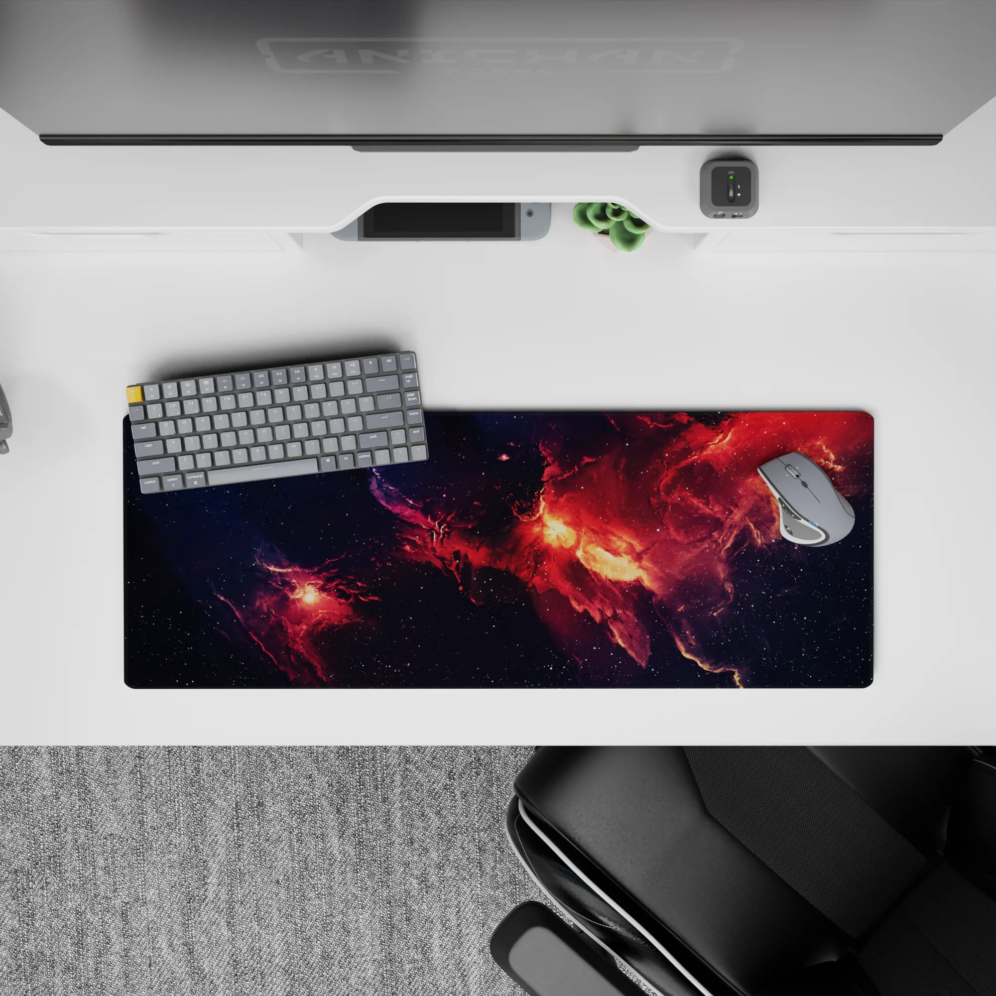 Inky navy fading into ember red and glowing orange, 32x12 inches mouse pad with cozy dramatic space vibe.