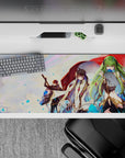 36x16 inches anime desk pad in sunset pastels with red cloak, blue sparks, and luxe black-gold details.