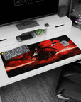 36x16 inches anime desk pad showing Alucard grinning, hand to chest, aiming a long pistol at night.