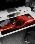 Hellsing Alucard 40x20 inches desk pad, coat flaring, one hand to chest, aiming a long pistol at you.