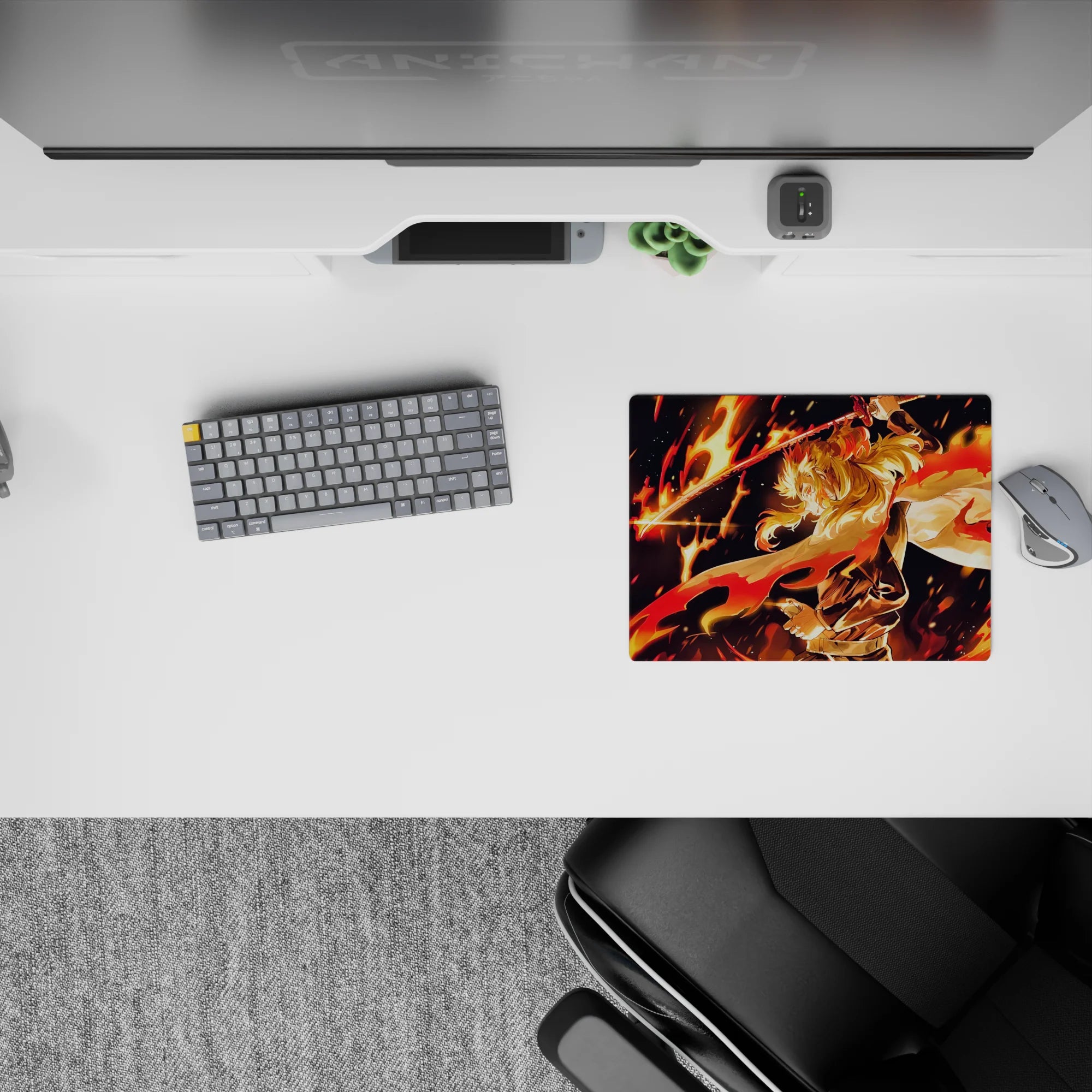 Rengoku from Demon Slayer on a 14x10 inch mouse pad, showcasing his fiery stance with vibrant orange, red, and gold hues.