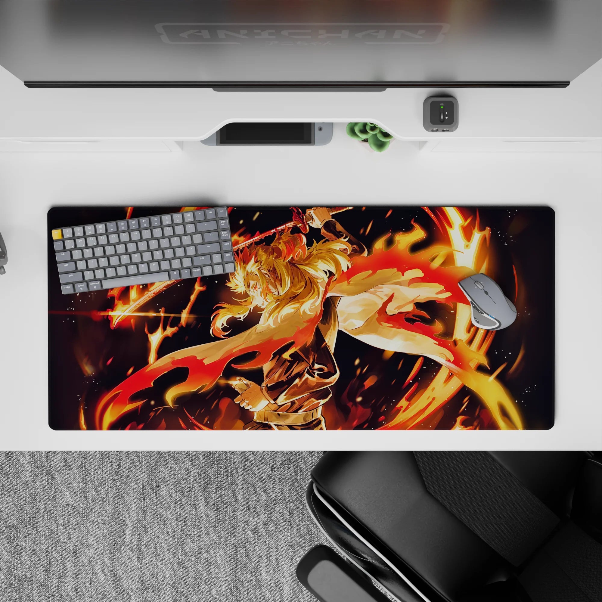 Rengoku from Demon Slayer on 36x16 inch mouse pad, fiery design with golden hair and sword in motion, vibrant colors.